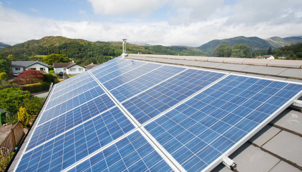 Solar voltaic panels on a house roof in Ambleside, Cumbria, UK.